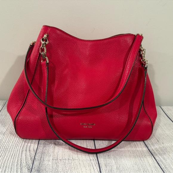 kate spade Handbags - Kate Spade Red Shoulder Bag with Versatile Straps/11x9in